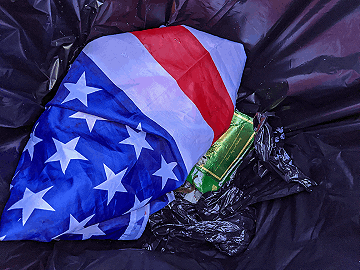 Drunk “patriots” throwing away their American flag!